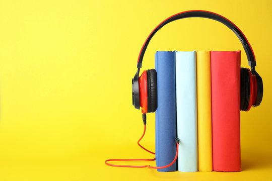 Print books wearing a pair of earphones